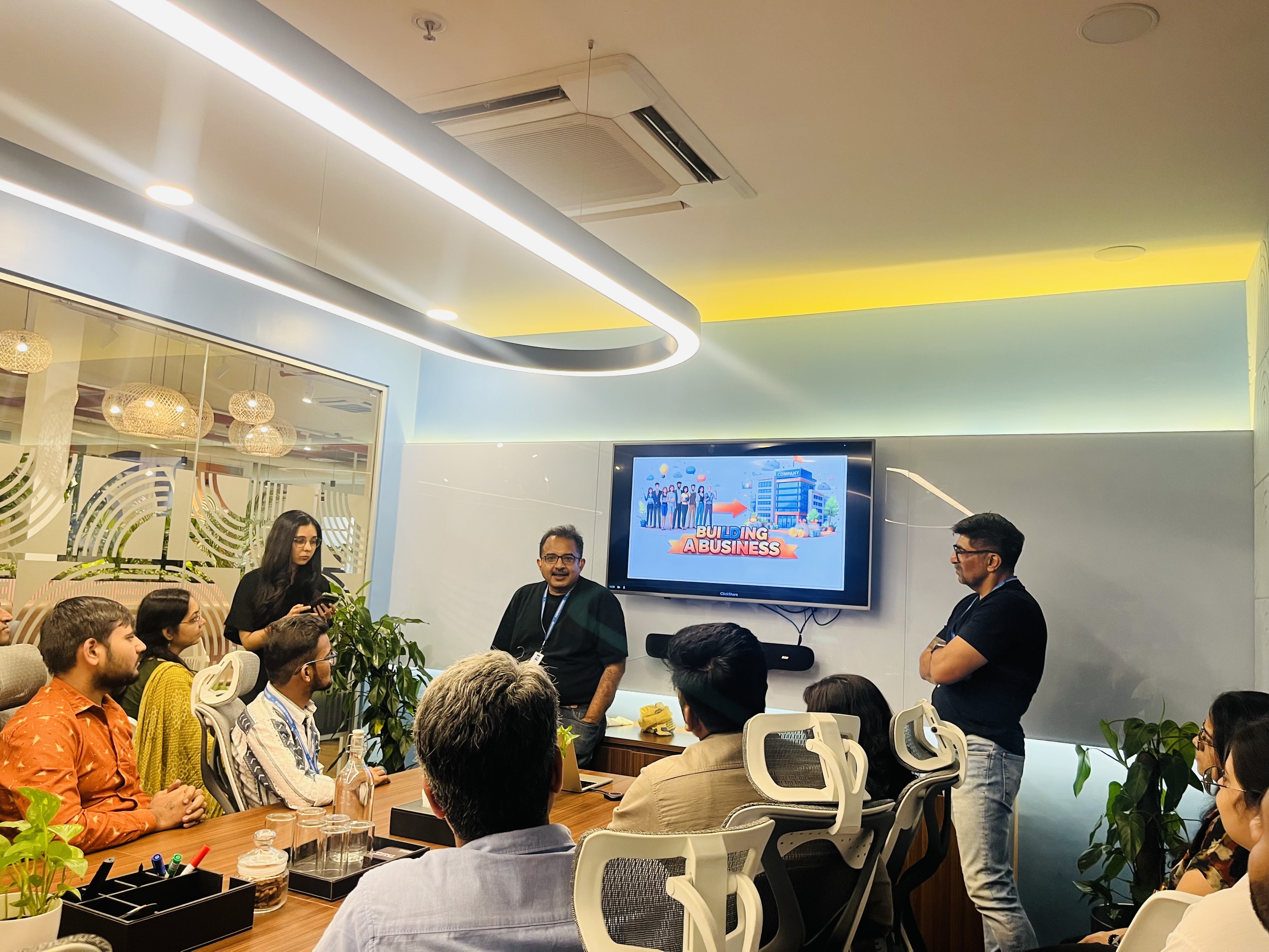 A team session titled Building a Business in the meeting room