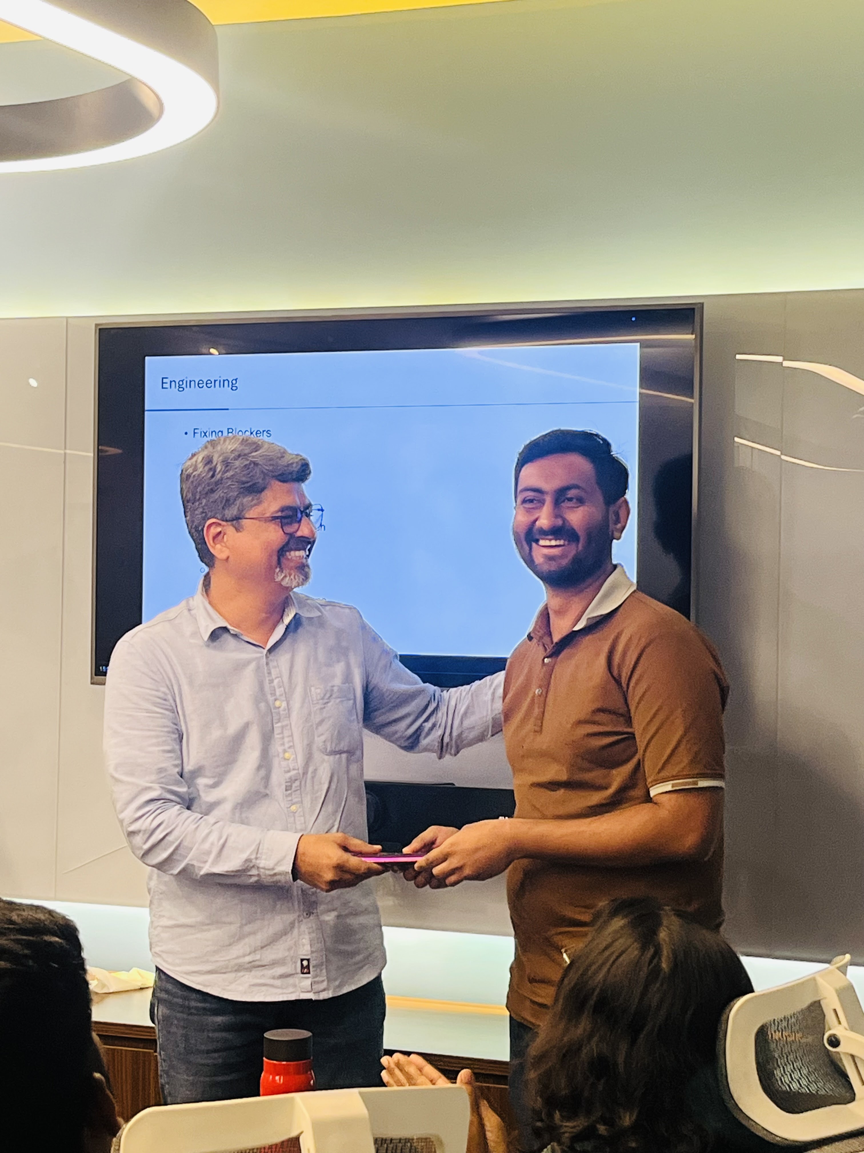 A team member receiving recognition during an engineering review